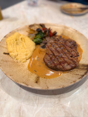 beef steak in ceramic plate