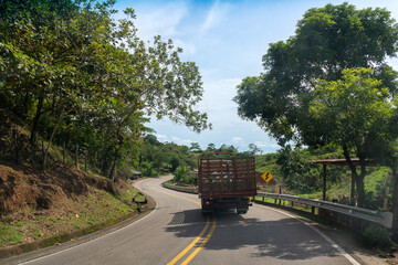 Medium truck on a curve of a rural Colombian road.