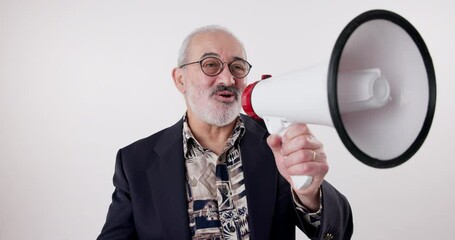 Megaphone, speech and senior man in studio for broadcast announcement, election news or info on white background. Microphone, noise and frustrated male speaker with message for change and vote