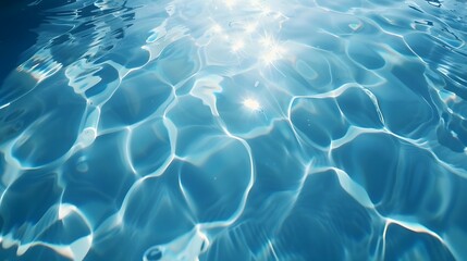 Fototapeta premium Pool water background, blue ripple water with sunlight reflection pattern. 
