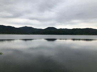 a landscape reflected by the river