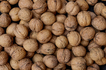 a pile of walnuts laying down on top of each other