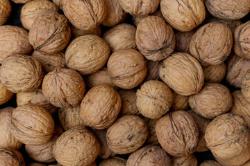a pile of walnuts laying down on top of each other