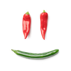 Smiling face made from pepper isolated on white