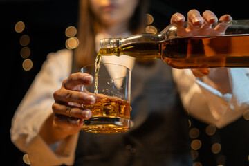 Barwoman pouring whiskey whiskey glass beautiful night