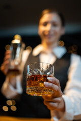 Barwoman pouring whiskey whiskey glass beautiful night