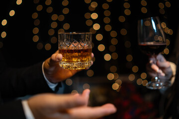 Celebrate whiskey on a friendly party in  restaurant.