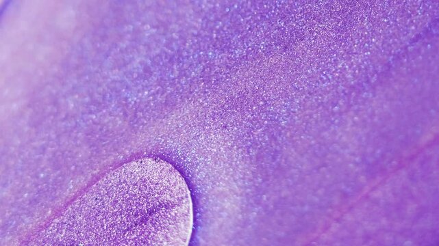 Glitter fluid spill. Paint water flow. Blur violet purple color sparkling texture gloss liquid wave glamour abstract art background.