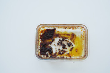 An empty dirty bowl on white background 