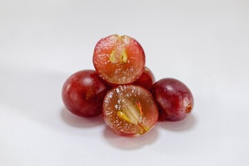 Fresh red grapes isolated on a white background