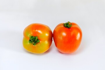 Fresh tomatoes isolated on white background