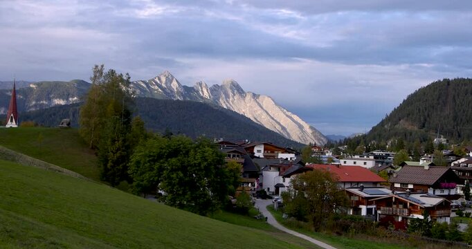 Scenic landscape of Seefeld town in Tyrol, Austria under evening light.