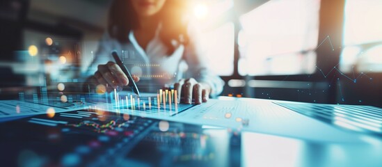 A businesswoman and data analyst working at her desk, with an interface displaying charts and indicators, enhanced by bokeh effect lights and sunset light streaming through the window, copy space.
