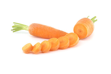 Whole carrot alongside its sliced pieces over white background