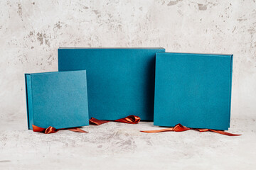 Gift boxes on a bright background with red ribbon