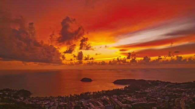 aerial hyperlapse view colorful sky of sunset above Kala island at Layan beach Phuket.
video 4K. Nature video High quality footage. 
Scene of Colorful romantic sky in sunset with cloud in the 