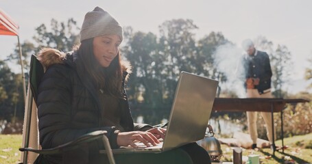 Camp, student or woman with laptop in nature for research, adventure or journey to countryside. Environment study, typing or female learner with tech for climate recording, conservation or ecology
