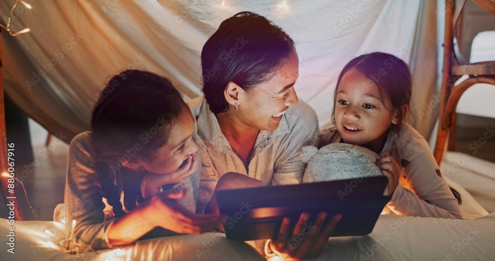 Sticker Reading, night and tablet with family on bed in home together for bonding, love or storytelling. Education, learning or relax with mother and sister kids in bedroom of apartment for child development