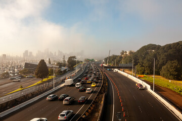 five lanes cars freeway foggy morning