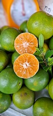 Orange tangerines are sold in the fresh market.