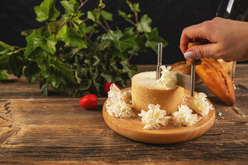 Woman slicing cheese