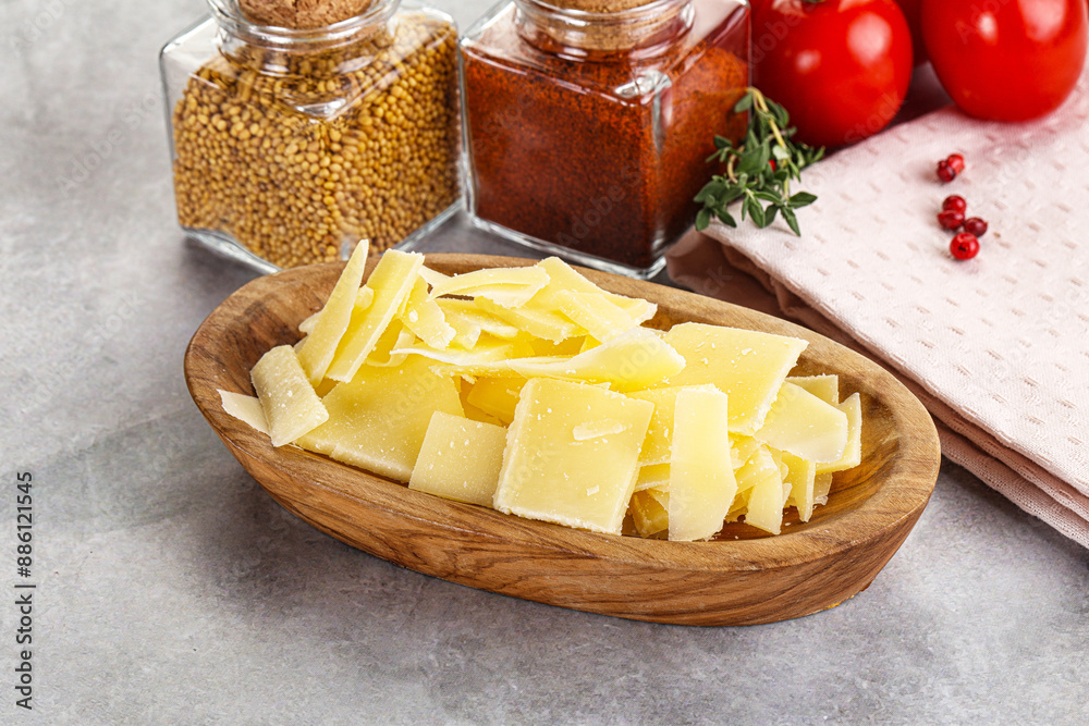 Wall mural sliced parmesan cheese in the bowl