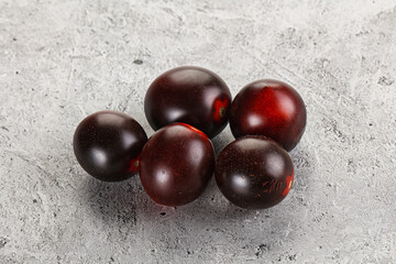 Raw ripe black kumato tomato