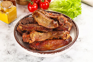 Roasted duck wings with sauce
