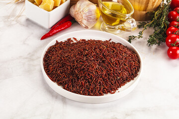 Red raw dry rice gor cooking