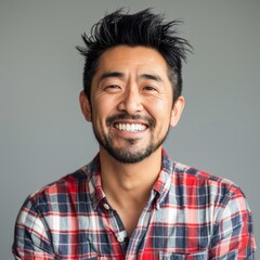 Obraz premium Smiling Man in Plaid Shirt, Asian Programmer Working with Artificial Intelligence. Chinese, Japanese, Korean, AI-Generated, 4K High-Resolution Wallpaper