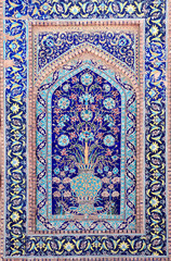 Obraz premium Vertical background with detail of ancient mosaic walls with floral and geometric ornament. Traditional tile decoration on wall, Samarkand, Uzbekistan