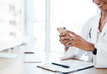 Fototapeta premium Hospital, clipboard and hand of doctor with phone for medical records, info and email to patient. Healthcare, professional and person with tech at desk for telehealth, diagnosis and treatment plan