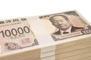 斜めのアングルで撮影した日本の新紙幣の500万円の束