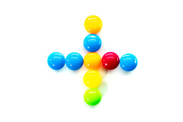 Plus. Math Symbol multicolored rainbow candies isolated on white background. alphabet and numbers