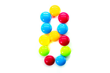 Digit 8 of multicolored rainbow candies isolated on white background. alphabet and numbers
