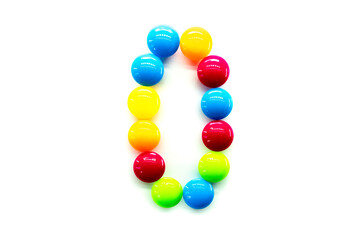 Digit 0 of multicolored rainbow candies isolated on white background. alphabet and numbers