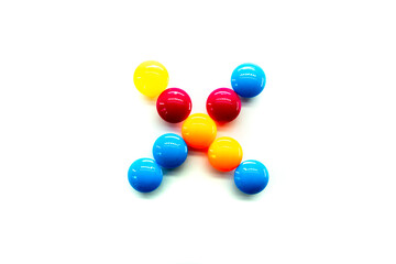 multiply. Math Symbol multicolored rainbow candies isolated on white background. alphabet and numbers
