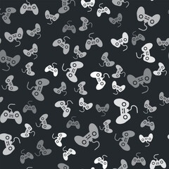 Grey Gamepad icon isolated seamless pattern on black background. Game controller. Vector