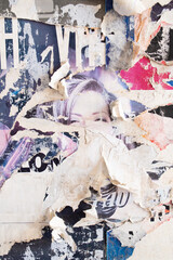 Ripped and torn old street poster background, messy and grungy paper collage backdrop