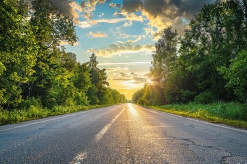Scenic drive through lush woods with stunning sunset sky - nature's beauty on display on the asphalt highway