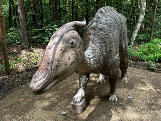 Zaurolof dinosaur. Realistic figure of an Zaurolof dinosaur inforest park in Kazimierz Sosnowiec. Prehistoric predator create a fascinating element of the landscape, attracting dinosaur lovers. © Chawran