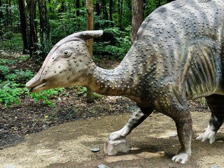 Zaurolof dinosaur. Realistic figure of an Zaurolof dinosaur inforest park in Kazimierz Sosnowiec. Prehistoric predator create a fascinating element of the landscape, attracting dinosaur lovers. © Chawran