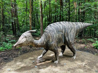 Zaurolof dinosaur. Realistic figure of an Zaurolof dinosaur inforest park in Kazimierz Sosnowiec. Prehistoric predator create a fascinating element of the landscape, attracting dinosaur lovers. © Chawran