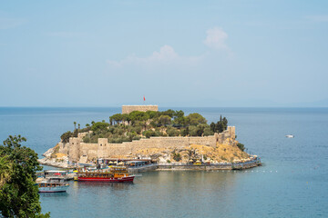 Fototapeta premium Aerial view of Guvercin Island in Kusadasi Aydin on a sunny day. Turkish name Guvercinada