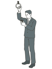 吊革につかまりながらスマホを見ているスーツ姿の男性のイラスト