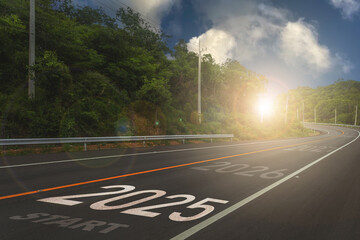 2025,The New Year 2025 or the beginning of the concept of the word 2025 is written on the road in the middle of the asphalt road with a sunset mountain backdrop, concepts.