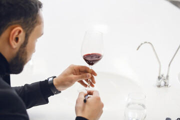 Unrecognizable Sommelier Analyzing Wine Color During Exam, Close up Photo with a Free Copy Space