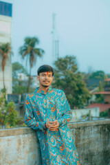 Fototapeta premium Picture of a Male Model posing outdoor. Man posing in creative lighting.