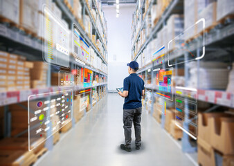 Asian worker or engineer in warehouse with cardboard boxes