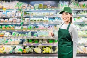 Asian seller wear green apron and green cap smiling